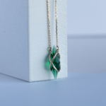 Golden necklace with lab grown emerald crystal
